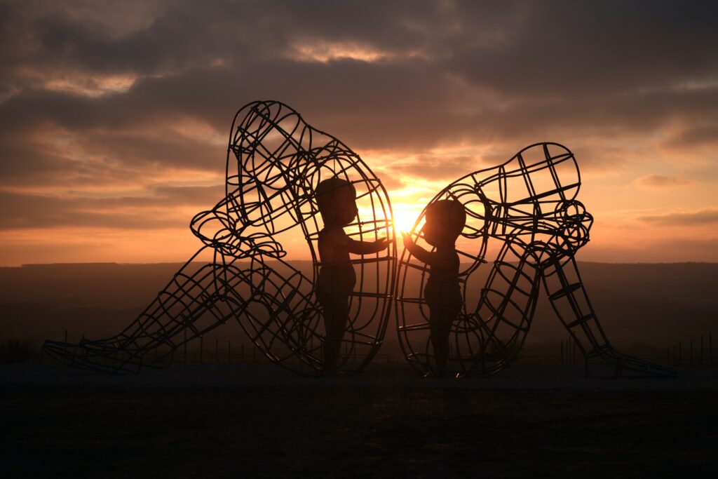 Burning man Art work in sunset 