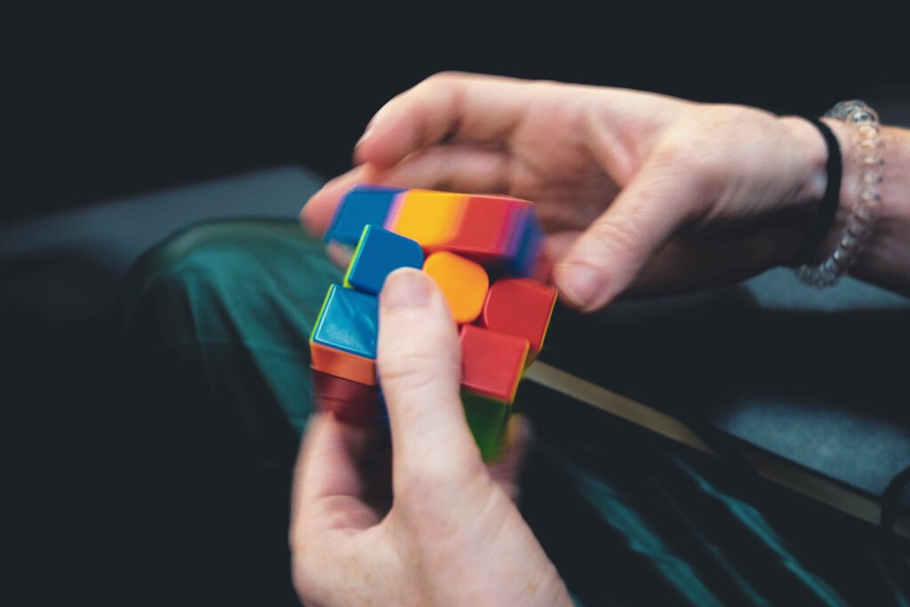 Hand play with rubiks cube 